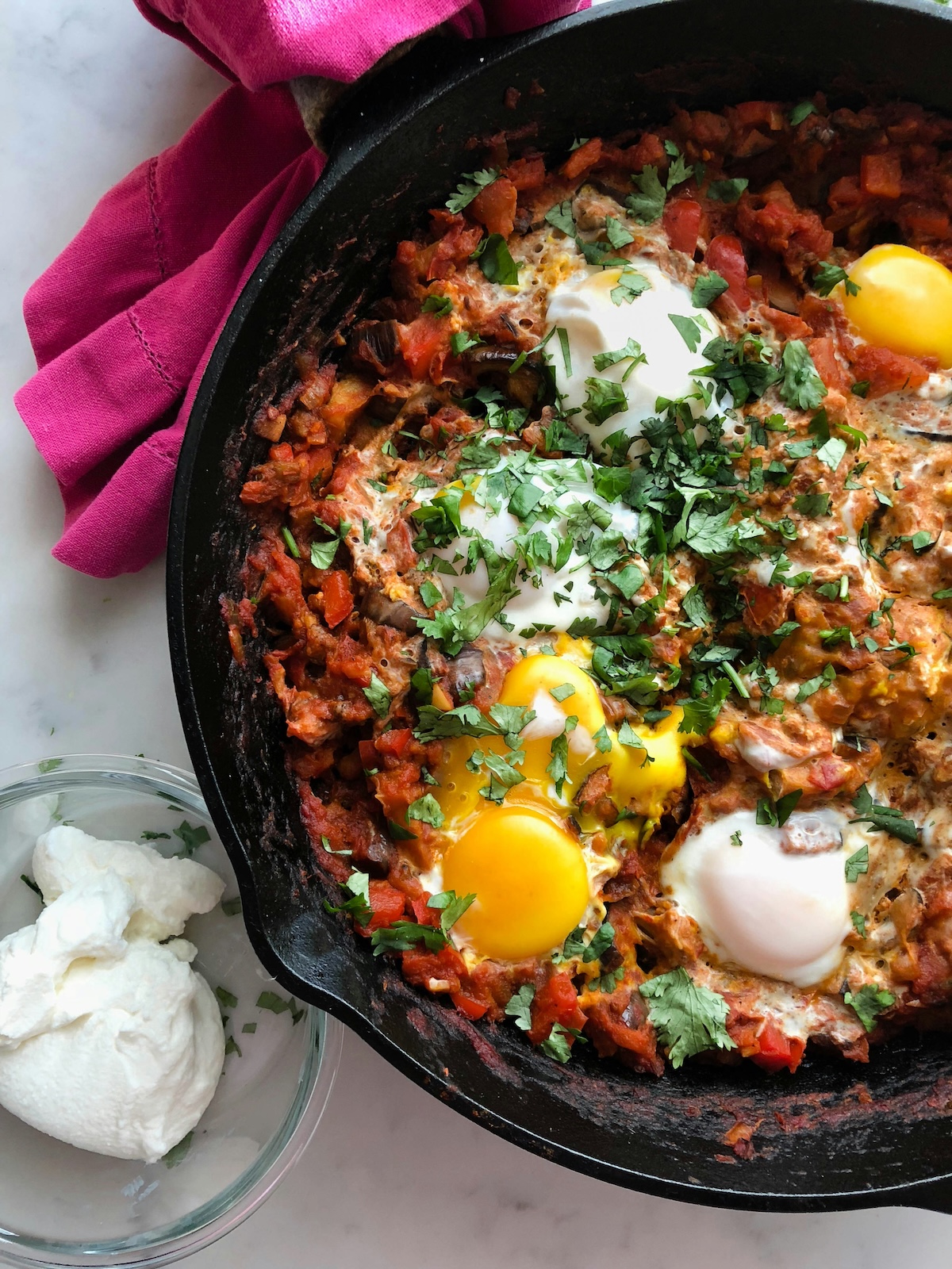 A cast iron pan containing Shakshuka.